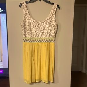 Lily Rose yellow sleeveless dress.